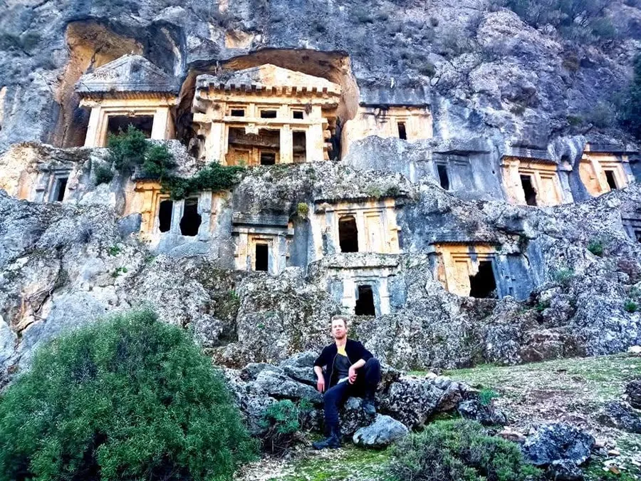 Ancient rock-cut tombs carved into a cliffside on Turkey's Lycian coast, near Myra