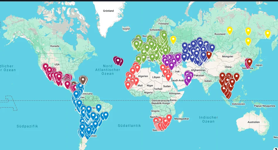 World map with pins marking every country Kamil has visited, roughly 86 in total